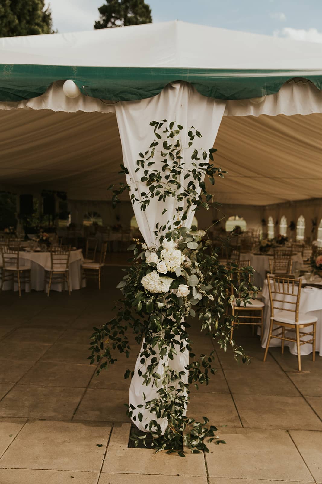 wedding tent entrance, wedding tent decor, wedding tent flowers, southern smilax wedding tent, wedding reception decor, reception entrance, reception tent, white and greenery wedding flowers, portland wedding florist, portland wedding flowers, oregon wedding florist, oregon wedding flowers, classic romantic wedding, bride and groom, engaged, wedding day, wedding flowers, wedding florist