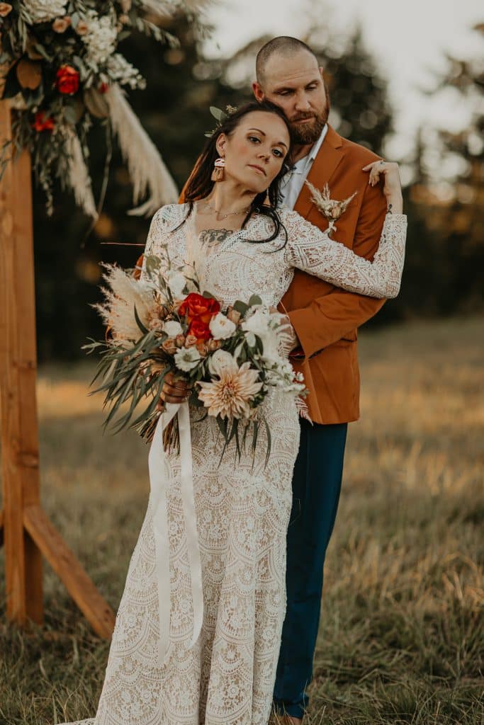 bride and groom, bridal gown , lace bridal gown, boho wedding, bohemian wedding, bohemian wedding flowers, boho bouquet, boho boutonniere, terra cotta palette, orange palette, outdoor wedding, oregon wedding flowers, oregon wedding florist, portland wedding flowers, portland wedding florist, brent family farm