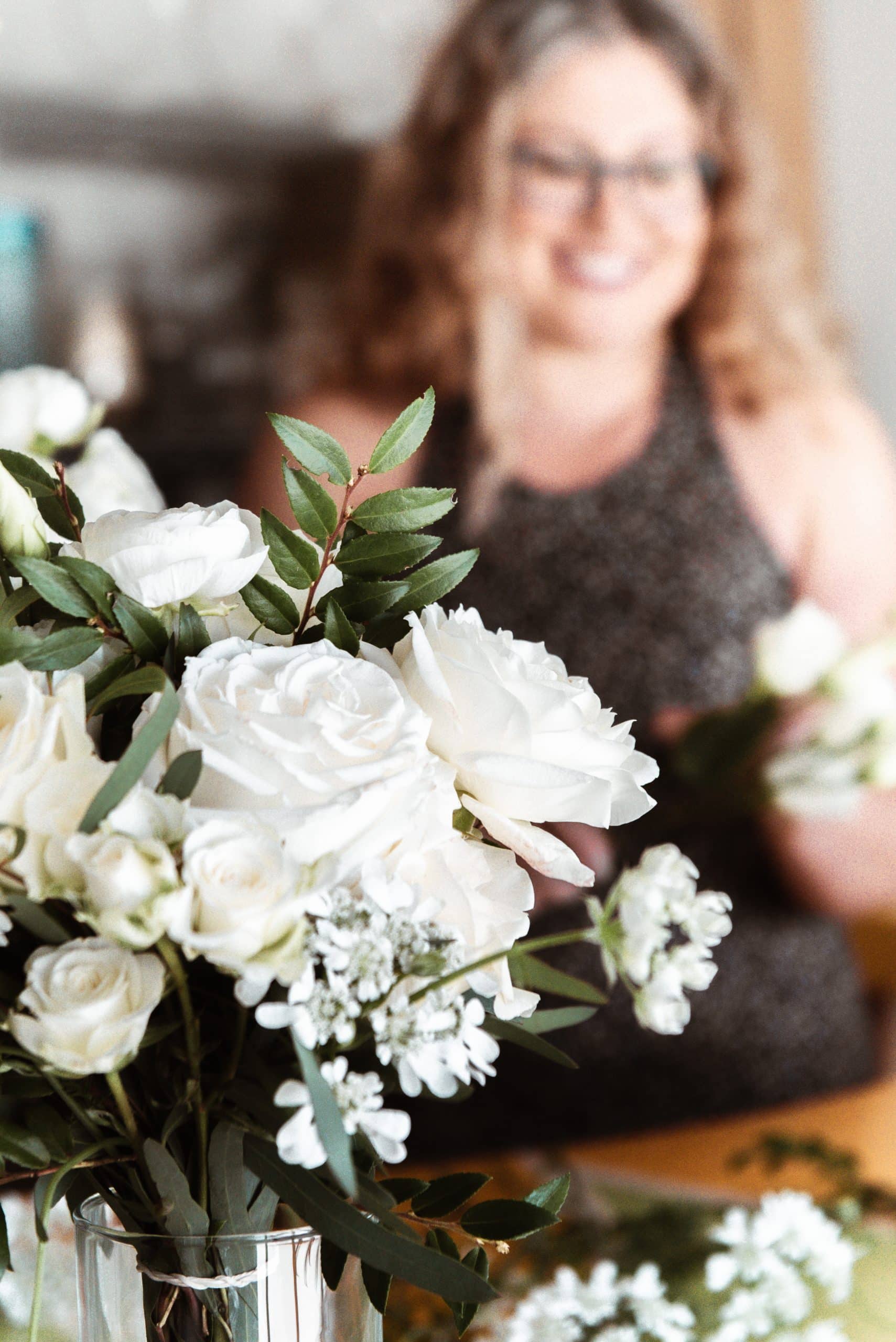 portland wedding florist flowers by alana behind a white bridesmaid bouquet