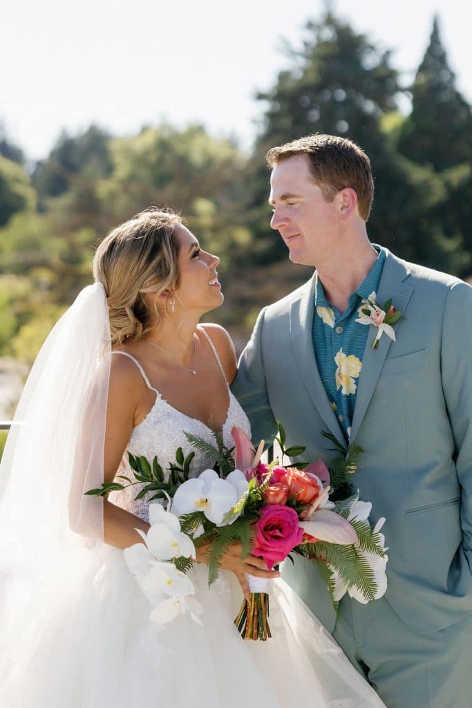 bride and groom and bridal bouquet at their modern tropical wedding at ironlight in lake oswego near portland, portland wedding florist, portland wedding flowers