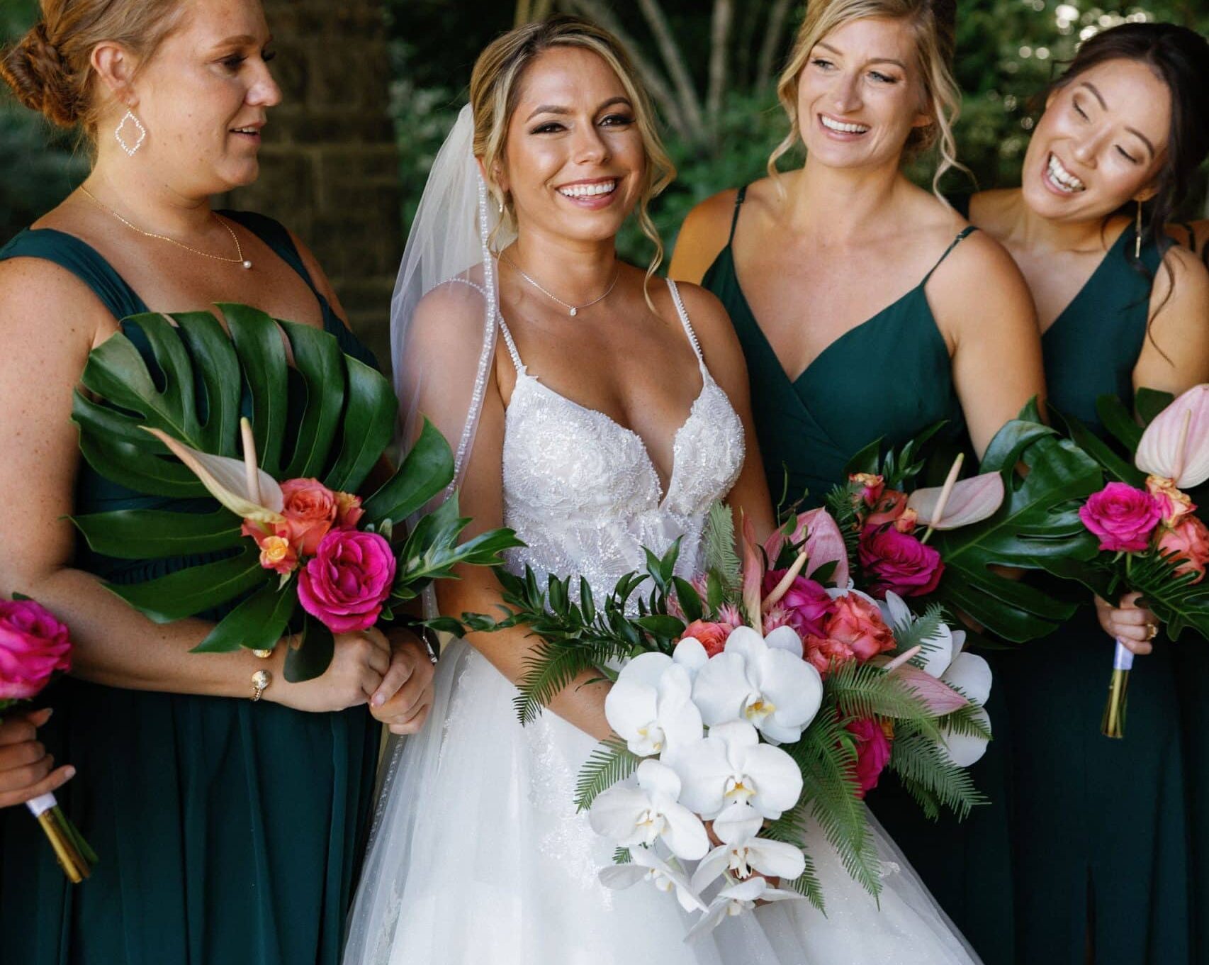 bride and bridesmaids carry tropical orchid bouquets at ironlight in lake oswego near portland