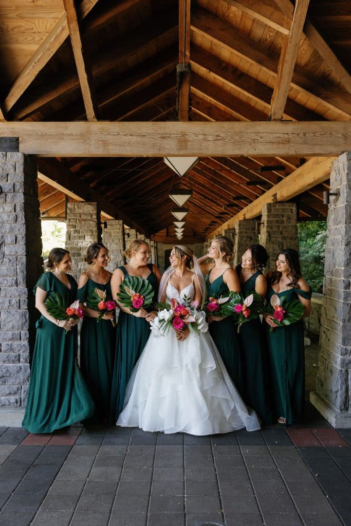 bride and bridesmaids carry modern tropical wedding bouquets at ironlight in lake oswego near portland, designed by Flowers by Alana